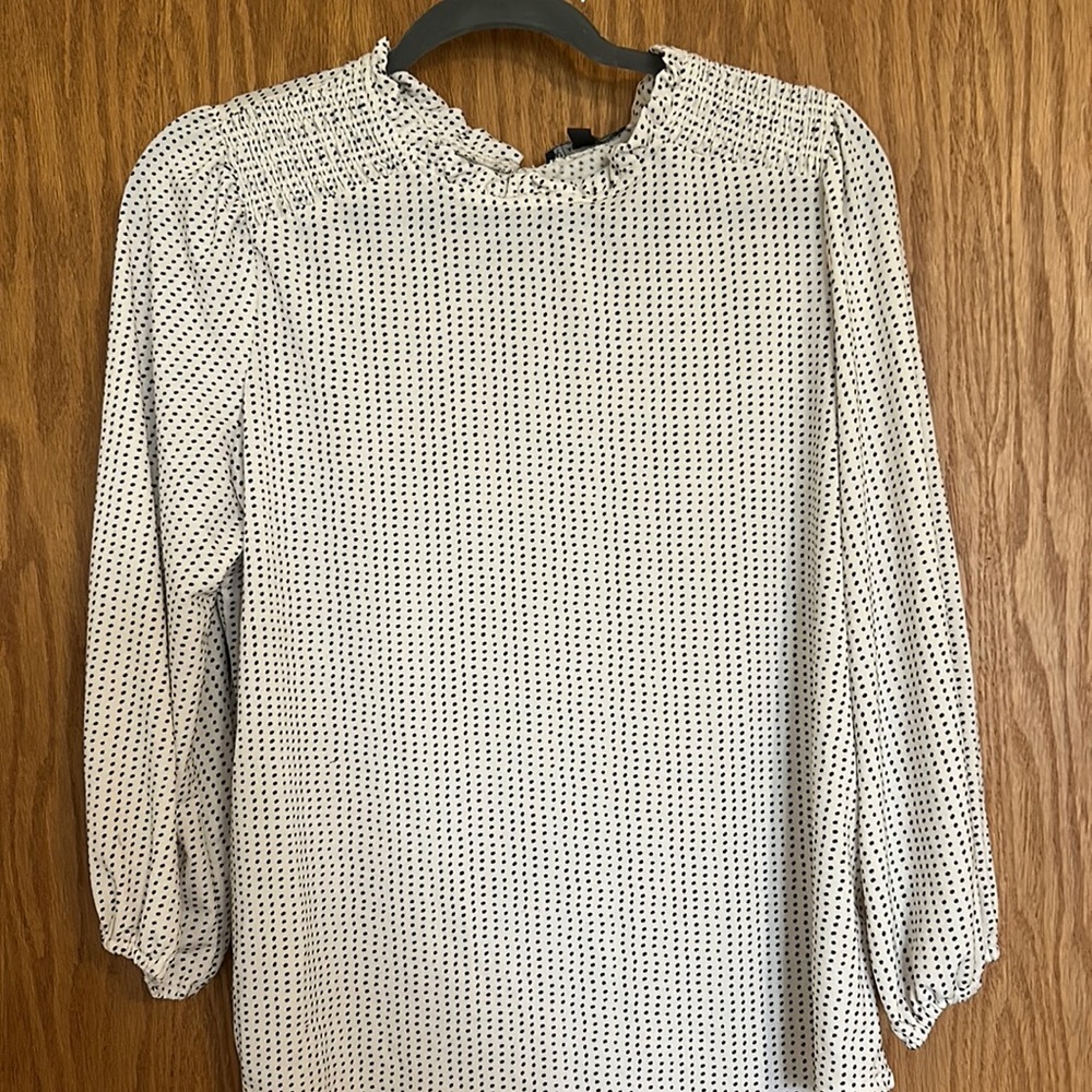 White and black polka dot blouse